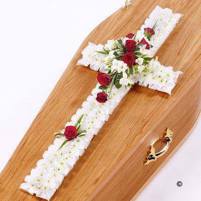<h2>Extra Large Classic Cross-Shaped Design in White and Red | Funeral Flowers</h2>
<ul>
<li>Approximate Size W 56cm H 160cm</li>
<li>Hand created extra-large classic white and red cross in fresh flowers</li>
<li>To give you the best we may occasionally need to make substitutes</li>
<li>Funeral Flowers will be delivered at least 2 hours before the funeral</li>
<li>For delivery area coverage see below</li>
</ul>
<br>
<h2>Liverpool Flower Delivery</h2>
<p>We have a wide selection of Funeral Crosses offered for Liverpool Flower Delivery. Funeral Crosses can be provided for you in Liverpool, Merseyside and we can organize Funeral flower deliveries for you nationwide. Funeral Flowers can be delivered to the Funeral directors or a house address. They can not be delivered to the crematorium or the church.</p>
<br>
<h2>Flower Delivery Coverage</h2>
<p>Our shop delivers funeral flowers to the following Liverpool postcodes L1 L2 L3 L4 L5 L6 L7 L8 L11 L12 L13 L14 L15 L16 L17 L18 L19 L24 L25 L26 L27 L36 L70 If your order is for an area outside of these we can organise delivery for you through our network of florists. We will ask them to make as close as possible to the image but because of the difference in stock and sundry items it may not be exact.</p>
<br>
<h2>Liverpool Funeral Flowers | Crosses</h2>
<p>This extra-large classic funeral cross has been loving handcrafted by our expert florists and features a mass of white spray chrysanthemums, together with a spray of red roses and white freesia and luscious green foliage completes this traditional design.</p>
<br>
<p>Funeral crosses are symbols of belief they reaffirm faith and provide comfort at this difficult time.</p>
<p><br />In the larger sizes (from 4ft up) they are appropriate as the main tribute but smaller sizes are sometimes chosen by close friends as they represent extremely personal sentiments and feelings.</p>
<br>
<p>Containing 45 white double spray chrysanthemums, 11 red large-headed roses, 14 white freesia and seasonal mixed foliage.</p>
<br>
<h2>Best Florist in Liverpool</h2>
<p>Trust Award-winning Liverpool Florist, Booker Flowers and Gifts, to deliver funeral flowers fitting for the occasion delivered in Liverpool, Merseyside and beyond. Our funeral flowers are handcrafted by our team of professional fully qualified who not only lovingly hand make our designs but hand-deliver them, ensuring all our customers are delighted with their flowers. Booker Flowers and Gifts your local Liverpool Flower shop.</p>
<br>
<p><em>Janice Crane - 5 Star Review on Google - Funeral Florist Liverpool</em></p>
<br>
<p><em>I recently had to order a floral tribute for my sister in laws funeral and the Booker Flowers team created a beautifully stunning arrangement. Thank you all so much, Janice Crane.</em></p>